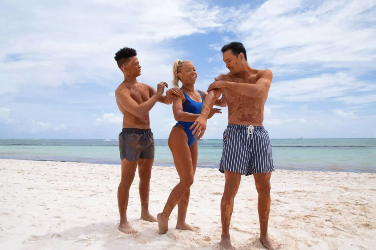 Melia Punta Cana Beach three guests applying suntan lotion